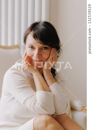 Mature woman smiling, looking away, reflecting, elegant portrait Mature woman smiling, looking away, reflecting, elegant portrait 132539529