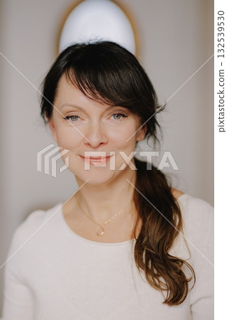 Mature woman smiling confidently, looking at camera 132539530