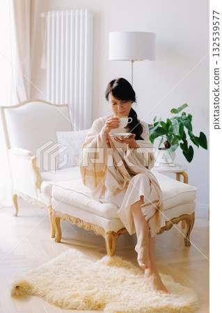 Woman relaxing with tea enjoying cozy hygge lifestyle at home 132539577