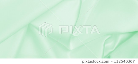 Smooth elegant green silk or satin luxury cloth texture as abstract background. Luxurious background design 132540307