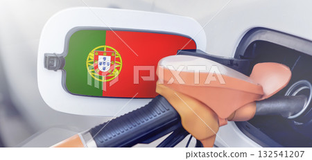 Portugal flag on the lid of the gas tank of a car at a gas station in close-up. High or low gasoline prices at Portuguese gas stations. Gasoline prices are rising due to a shortage of diesel fuel 132541207