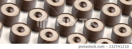 Delicious chocolate candies arranged in perfect rows against a light background showcasing their rich flavors and appealing appearance 132541210