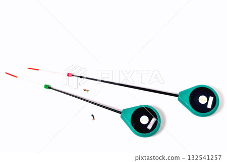 Fitted fishing rods for winter fishing on a white background, close-up Fitted fishing rods for winter fishing on a white background, close-up 132541257