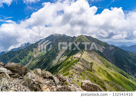 Mt. Ainotake seen from the hiking trail to Kitadake Sanso Mountain Lodge. Climbing Mt. Kitadake in the Southern Alps Mt. Ainotake seen from the hiking trail to Kitadake Sanso Mountain Lodge. Climbing Mt. Kitadake in the Southern Alps 132541410