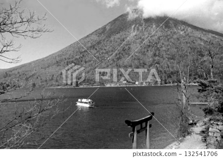 Old photo from 1956 in Nikko, Lake Chuzenji, Mt. Nantai and the torii gate of Nikko Futarasan Shrine Old photo from 1956 in Nikko, Lake Chuzenji, Mt. Nantai and the torii gate of Nikko Futarasan Shrine 132541706