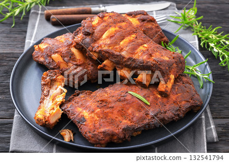 bbq baby pork ribs with fresh rosemary on a plate 132541794