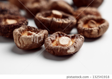 Dried edible Japanese shiitake mushrooms on ceramic dish 132541918