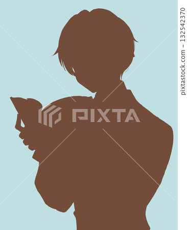 Boy reading a big book silhouette Boy reading a big book silhouette 132542370
