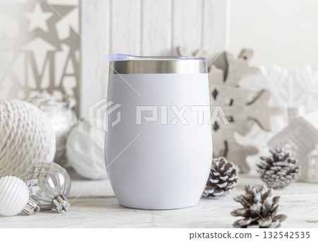 White blank Stainless Steel wine tumbler near Christmas baubles and decor on table, mockup White blank Stainless Steel wine tumbler near Christmas baubles and decor on table, mockup 132542535