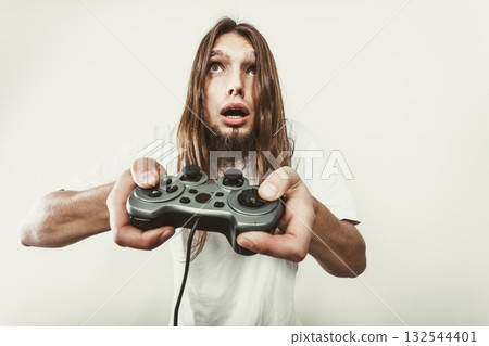 Unhappy male playing games 132544401