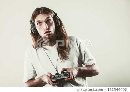 Unhappy male playing games 132544402