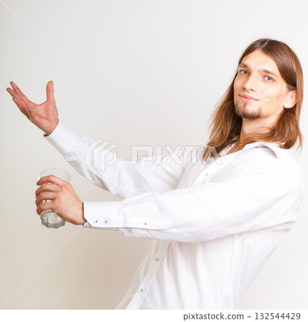 Skilled bartender juggling with glass. 132544429