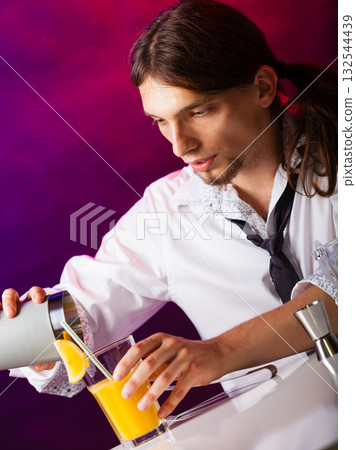 Young man bartender preparing alcohol cocktail drink Young man bartender preparing alcohol cocktail drink 132544439