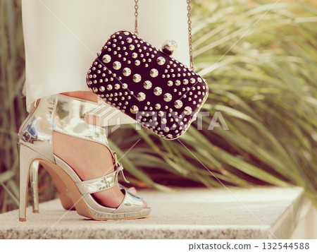 Silver high heels, purse and white long skirt Silver high heels, purse and white long skirt 132544588