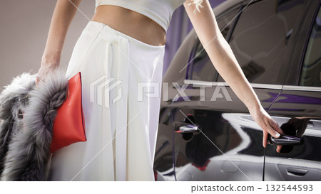 Fashionable woman opening car Fashionable woman opening car 132544593