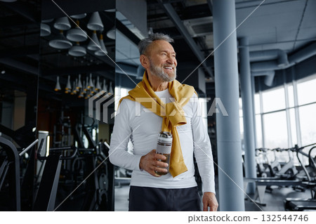 Active senior man at gym with water bottle, wearing sport clothing Active senior man at gym with water bottle, wearing sport clothing 132544746