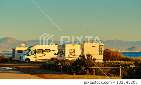 Camper cars on beach sea shore Camper cars on beach sea shore 132545203