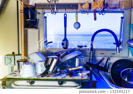 Caravan inside, clean dishes drying in kitchen 132545217