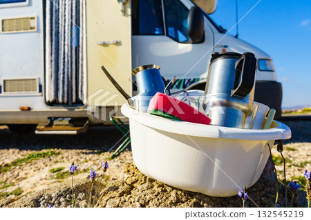 Washing dishes in bowl, capming outdoor 132545219