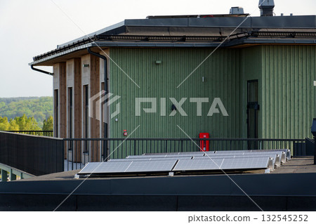 Solar panels on roof of apartment building, renewable green sustainable energy concept, water cooling, aerial view, Gothenburg, Sweden Solar panels on roof of apartment building, renewable green sustainable energy concept, water cooling, aerial view, Gothenburg, Sweden 132545252