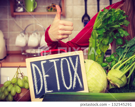 Woman having green diet vegetables, detox sign Woman having green diet vegetables, detox sign 132545291