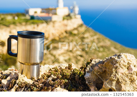 Thermal mug, thermos on nature. Travel outdoor picnic. Thermal mug, thermos on nature. Travel outdoor picnic. 132545363