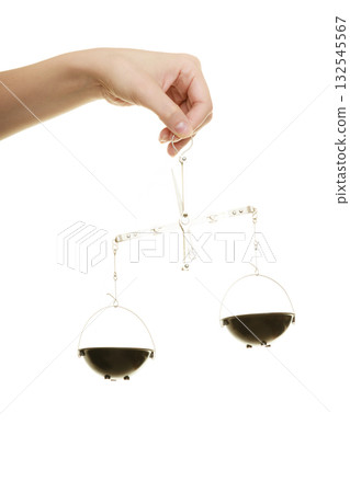 Law court. Female hand holds scales symbol of justice. Law court. Female hand holds scales symbol of justice. 132545567