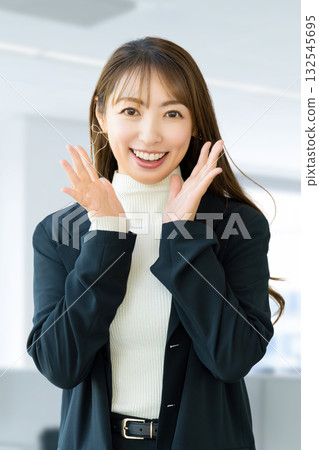 Smiling woman calling out, businesswoman 132545695