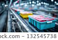 Colorful plastic boxes with raw meat on conveyor belt in modern factory with bokeh lights 132545738