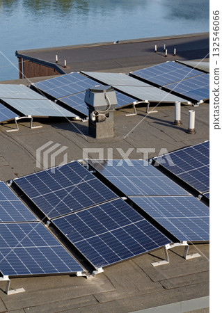 Solar panels on roof of apartment building, renewable green sustainable energy concept, water cooling, aerial view 132546066