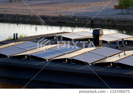 Solar panels on roof of apartment building, renewable green sustainable energy concept, water cooling, aerial view 132546075