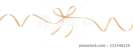 Golden decorative ribbon tied in a bow isolated on white background for festive gift wrapping and holiday design Golden decorative ribbon tied in a bow isolated on white background for festive gift wrapping and holiday design 132546229