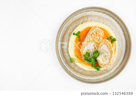 Top view of breaded chicken cutlet with mashed potatoes, carrot puree and green peas on ceramic plate on white background copy space, restaurant menu, banner, flyer or advertising template Top view of breaded chicken cutlet with mashed potatoes, carrot puree and green peas on ceramic plate on white background copy space, restaurant menu, banner, flyer or advertising template 132546389