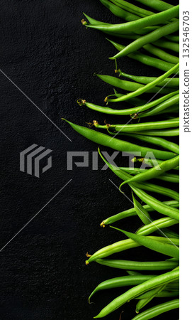 Fresh green beans arranged on a dark surface for culinary use Fresh green beans arranged on a dark surface for culinary use 132546703