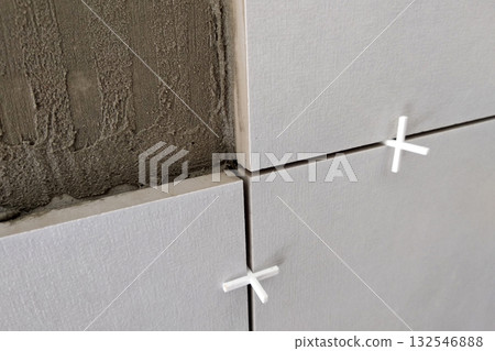 Wall ceramic tiles installation on mortar glue. Wall ceramic tiles installation on mortar glue. 132546888