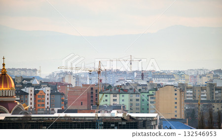 Tower cranes at high residential apartment buildings construction site. Real estate development 132546953
