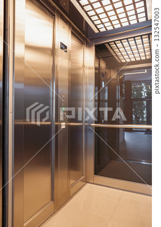 Glass Door Elevator Leading to Another Room Glass Door Elevator Leading to Another Room 132547003