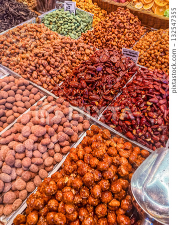 Colorful Variety of Candied Nuts and Dried Fruits at Market Stall 132547355