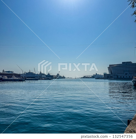 Harbor with Yachts and Cruise Terminal under Blue Sky 132547356