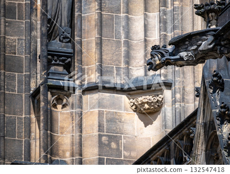 Prague, Czech Republic, August 8, 2023. View of the gargoyles of St. Vitus Cathedral. Beautiful summer day. Travel destinations. Prague, Czech Republic, August 8, 2023. View of the gargoyles of St. Vitus Cathedral. Beautiful summer day. Travel destinations. 132547418
