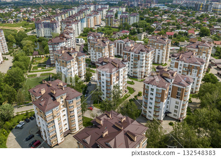 Top view of apartment or office tall buildings, parked cars, urban city landscape. Drone aerial photography. 132548383