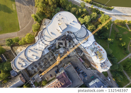 Top aerial view of a skyscraper under construction. Top aerial view of a skyscraper under construction. 132548397