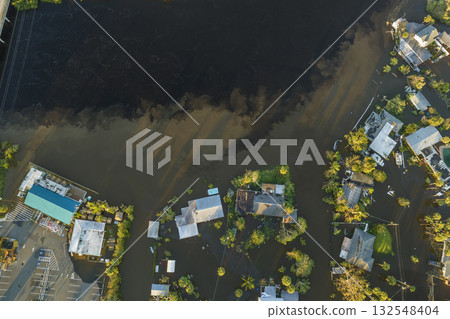Surrounded by hurricane Ian rainfall flood waters homes in Florida residential area. Aftermath of natural disaster Surrounded by hurricane Ian rainfall flood waters homes in Florida residential area. Aftermath of natural disaster 132548404