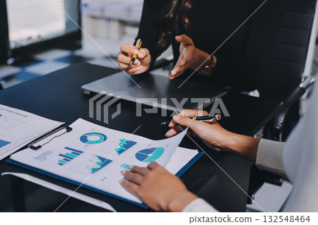 Accounting company provide finance and taxation planning for profitable cash flow, Auditor and accountant team working in office, analyze financial data and accounting record with calculator.Insight Accounting company provide finance and taxation planning for profitable cash flow, Auditor and accountant team working in office, analyze financial data and accounting record with calculator.Insight 132548464