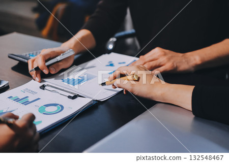 Accounting company provide finance and taxation planning for profitable cash flow, Auditor and accountant team working in office, analyze financial data and accounting record with calculator.Insight Accounting company provide finance and taxation planning for profitable cash flow, Auditor and accountant team working in office, analyze financial data and accounting record with calculator.Insight 132548467