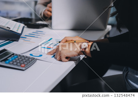 Accounting company provide finance and taxation planning for profitable cash flow, Auditor and accountant team working in office, analyze financial data and accounting record with calculator.Insight Accounting company provide finance and taxation planning for profitable cash flow, Auditor and accountant team working in office, analyze financial data and accounting record with calculator.Insight 132548474