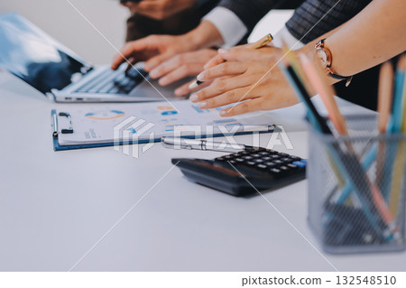 Accounting company provide finance and taxation planning for profitable cash flow, Auditor and accountant team working in office, analyze financial data and accounting record with calculator.Insight 132548510