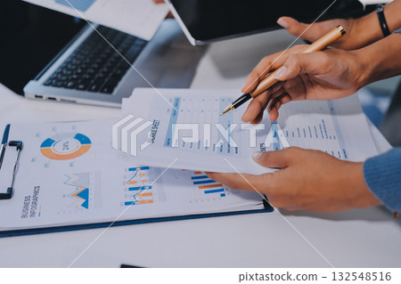Accounting company provide finance and taxation planning for profitable cash flow, Auditor and accountant team working in office, analyze financial data and accounting record with calculator.Insight Accounting company provide finance and taxation planning for profitable cash flow, Auditor and accountant team working in office, analyze financial data and accounting record with calculator.Insight 132548516