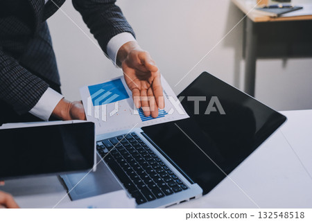 Accounting company provide finance and taxation planning for profitable cash flow, Auditor and accountant team working in office, analyze financial data and accounting record with calculator.Insight Accounting company provide finance and taxation planning for profitable cash flow, Auditor and accountant team working in office, analyze financial data and accounting record with calculator.Insight 132548518
