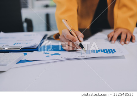 Accounting company provide finance and taxation planning for profitable cash flow, Auditor and accountant team working in office, analyze financial data and accounting record with calculator.Insight 132548535